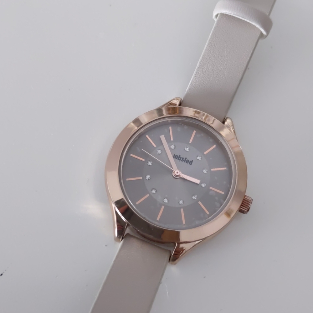 EUC Unlisted by Kenneth Cole rose gold watch